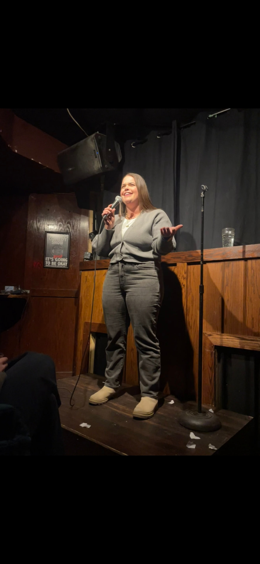 Brooke performing stand-up comedy